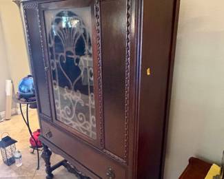 antique Jacobean Revival china cabinet or curio hutch