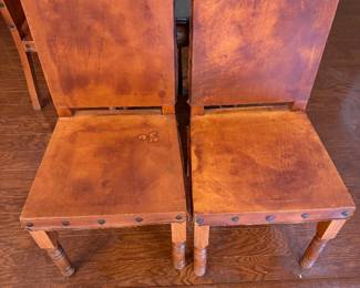 antique round oak dining table featuring carved lion's paw or claw feet