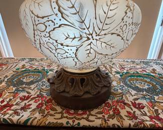 vintage table lamp features a white etched glass body