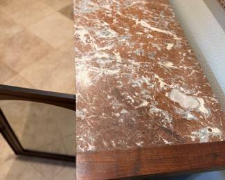 antique wooden fireplace mantel featuring a reddish-brown marble top and a centered mirror