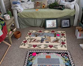 Wicker daybed, decorative rugs