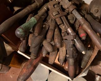 Antique wrenches and other hand tools with wooden handles