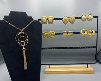 Gold Earrings With A Gold Necklace 