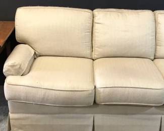 Upholstered Couch With Vintage Side Table 