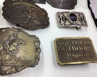8 vtg. Belt buckles. NRA, NFL, Bambu, Railroad, lion. Great selection. Wells Fargo buckle is missing fastener hardware on back