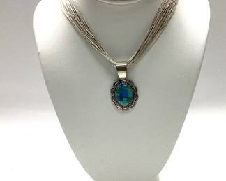  VTG. RELIOS CAROLYN POLLACK LIQUID STERLING SILVER NECKLACE FEATURING A TURQUOISE INLAY PENDENT AND STERLING SILVER DESERT PEARL COIL BRACELET