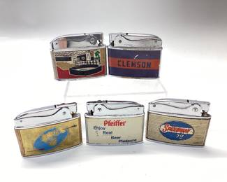 5 ADVERTISING POCKET LIGHTERS SPEEDWAY 79, PFEIFFER, INTERNATIONAL TRADERS, CLEMSON TIGERS AND ALI BABA