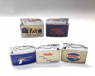 5 ADVERTISING POCKET LIGHTERS SPEEDWAY 79, PFEIFFER, INTERNATIONAL TRADERS, CLEMSON TIGERS AND ALI BABA