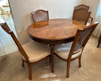 Hickory dining table, 2 captains chairs, 4 side chairs, 2 leaves and pads (not pictured)