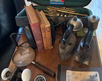 Antique trumpet, irons, books, etc…
