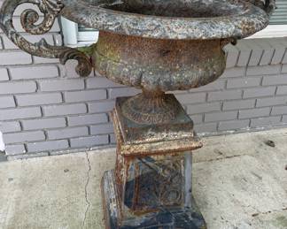 Cast iron urn on pedestal