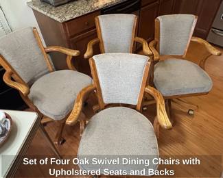 Set of Four Oak Swivel Dining Chairs with Upholstered Seats and Backs