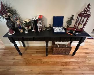 Couch table with a beautiful selection of book ends and various pieces