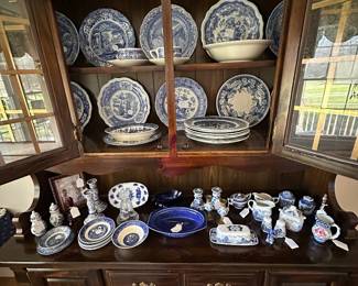 Traditional hutch with a selection  of blue and white China pieces