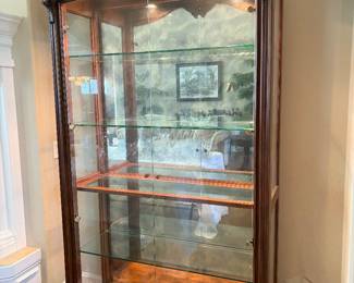 Curio cabinet with double doors and lighting