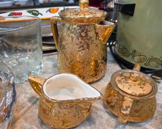 Vtg McCoy pottery in gold