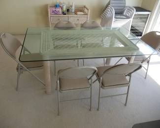Wicker & glass dining table. Folding chairs