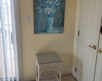 Wicker accent table; floral artwork