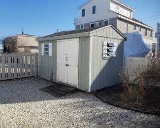 Shed is approximately 9' x 11 ft. Roof is good - doors & wall need repair