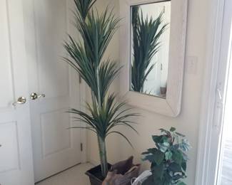 Rattan mirror matches etageres & one-drawer cupboard; faux botanicals