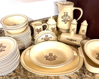 A vintage Pfaltzgraff Village pattern stoneware dinnerware set