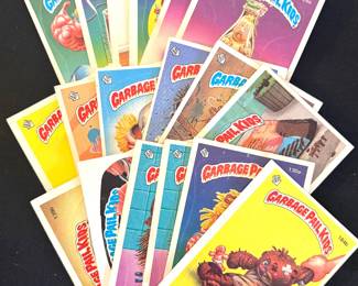 A collection of 1980s Garbage Pail Kids sticker trading cards. 