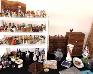 Vintage salt and pepper shakers and display cases 