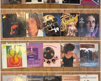 Collection of vintage vinyl records including artists such as: The Marshall Tucker Band,  Linda Ronstadt ,  The Stanky Brown Group. 