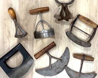 Collection of antique food choppers, mezzalunas and ulu knives.