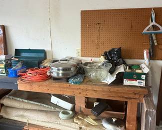 Assorted Garage and Household Items on Wooden Workbench