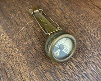 Military pin on compass