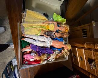 Box full of Barbie’s and clothes some are antiques 