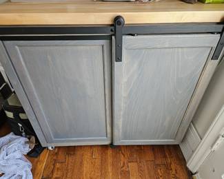 Small handmade pantry with butcher block top