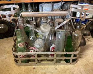 NUMEROUS BOTTLES AND CARRIERS