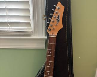 R32 - $30. Jackson Electric Guitar. I don't see a model # and there is damage where the strap is attached.