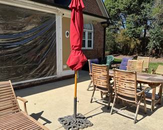 R59 - $60. HEAVY Iron Umbrella Stand. Includes umbrella that is in like new condition! Umbrella has been stored inside and is NOT sun faded. Base is 22" square.