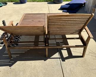 R57 - $450. Teak Double Chaise. Measures 61" wide x 80" long. Has been stored covered but there is a little dirt around the feet. Each side adjusts separately! Cushions are still useable.