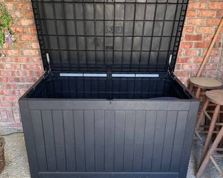 R64 - $125. Large Plastic Deck Box. Measures 58" wide x 32" deep x 34" tall.