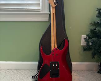 R32 - $30. Jackson Electric Guitar. I don't see a model # and there is damage where the strap is attached.