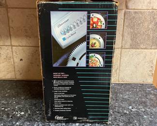 R76 - $30. Vintage Osterizer Blender. Never used. Removed from box for photos.