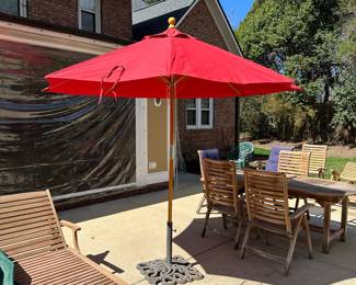 R59 - $60. HEAVY Iron Umbrella Stand. Includes umbrella that is in like new condition! Umbrella has been stored inside and is NOT sun faded. Base is 22" square.