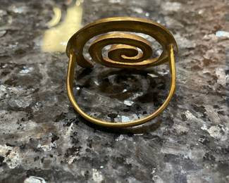 R84 - $25. Set of 14 Brass Spiral Napkin Rings.