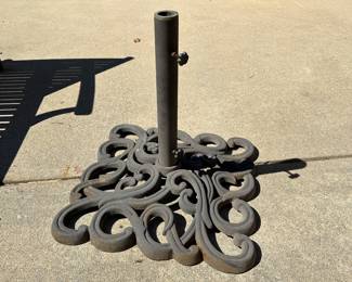 R59 - $60. HEAVY Iron Umbrella Stand. Includes umbrella that is in like new condition! Umbrella has been stored inside and is NOT sun faded. Base is 22" square.