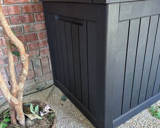 R64 - $125. Large Plastic Deck Box. Measures 58" wide x 32" deep x 34" tall.