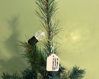 R20 - $25. 54" Artificial Christmas Tree.