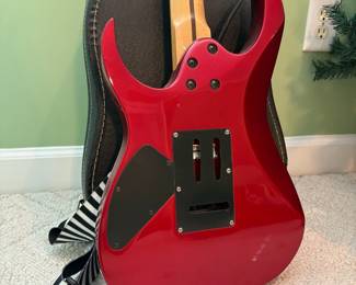R32 - $30. Jackson Electric Guitar. I don't see a model # and there is damage where the strap is attached.