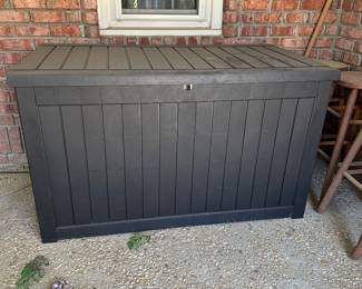 R64 - $125. Large Plastic Deck Box. Measures 58" wide x 32" deep x 34" tall.