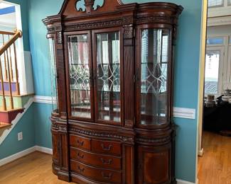 Universal Furniture Lighted China Cabinet. Moves in 2 pieces. Measures 70" wide x 20" deep x 90" tall.
