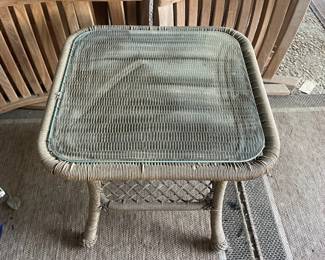 R14 - $30. Square side table. Plastic Rattan with glass top. Measures 21.75" square x 19.75" tall.