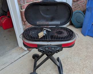 R55 - $125. Coleman RoadTrip Propane Grill on Folding Stand.